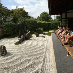 Students sitting on the veranda overlooking the abbot's garden at Zuiho-in